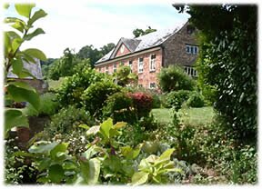Main House through the foliage at Harts Barn