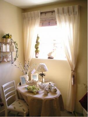 Viole curtains over roman blind